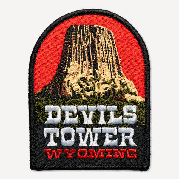 Patch of Devils Tower Wyoming with red background
